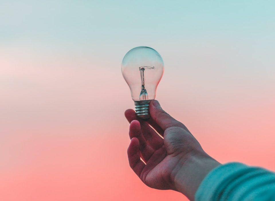 person holding light bulb